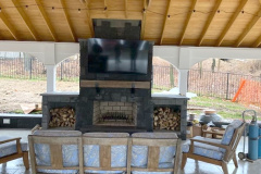 Outdoor Fireplace Kit in a Backyard Pavilion