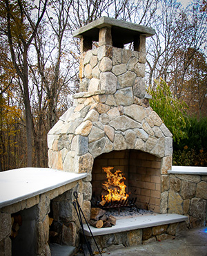 48 inch Contractor Fireplace in a stone kitchen
