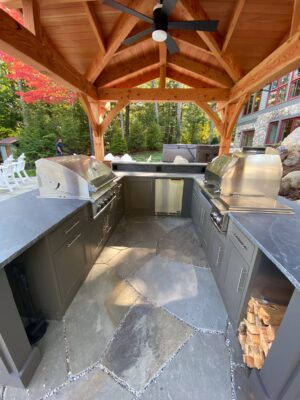 Backyard pavilion with a Challenger metal outdoor kitchen cabinets