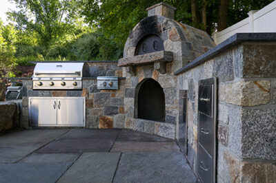 Stone Age outdoor kitchen with non-masonry components