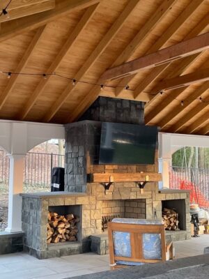 modern outdoor fireplace with a tv