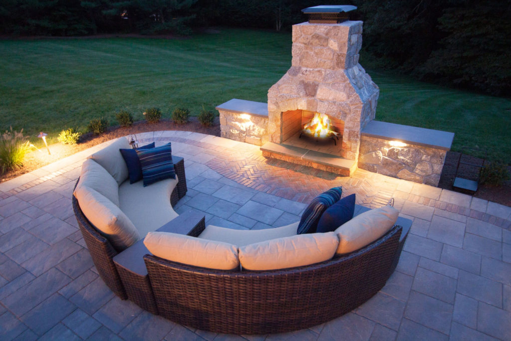 masonry outdoor fireplace in backyard